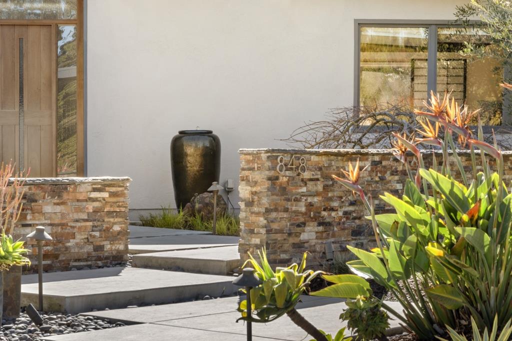 Undisclosed Address Stanford, CA 94305 - Photo 2 of 45 a bathroom with a granite countertop shower a mirror and a sink