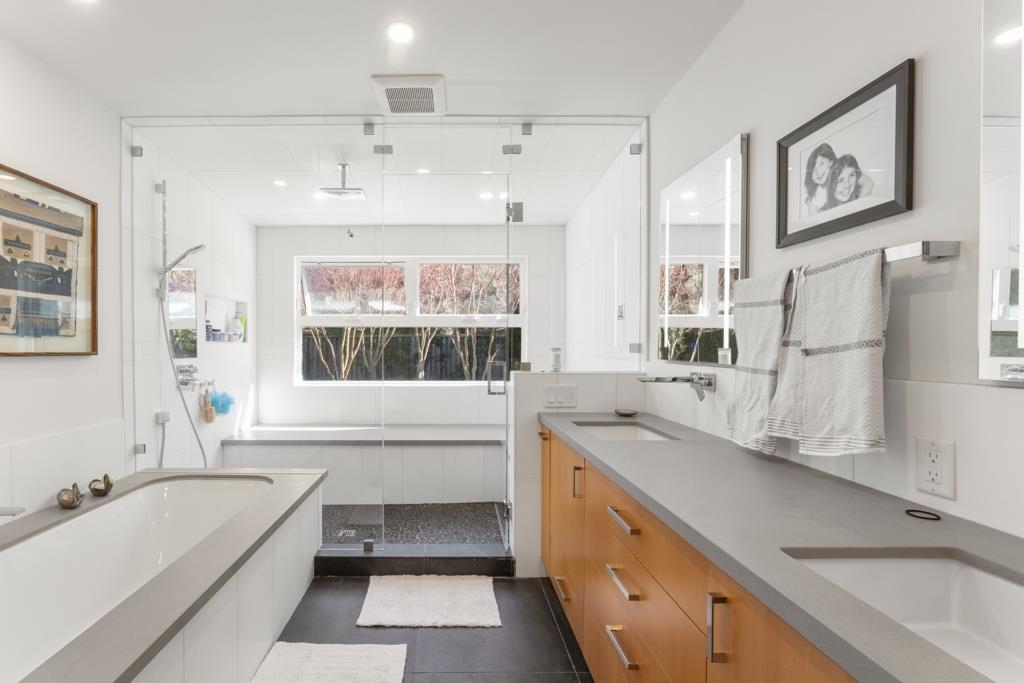 Undisclosed Address Stanford, CA 94305 - Photo 33 of 45 a bathroom with a granite countertop tub sink and mirror