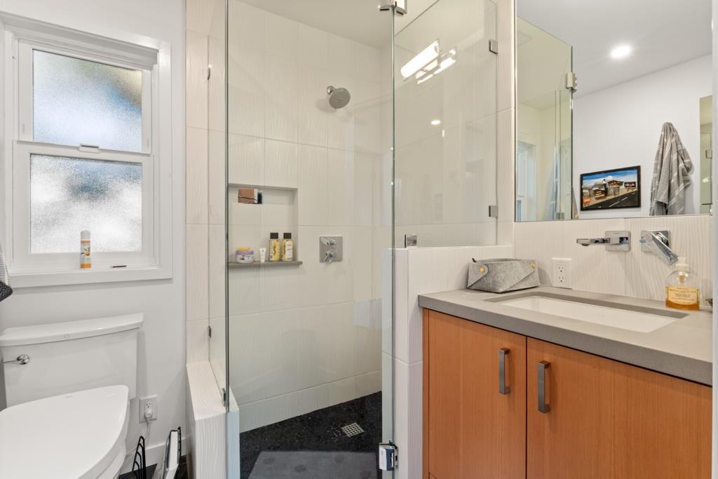 Undisclosed Address Stanford, CA 94305 - Photo 41 of 45 a bathroom with a sink a toilet and a mirror