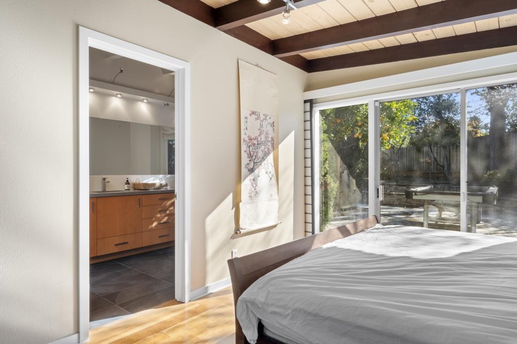 Undisclosed Address Stanford, CA 94305 - Photo 45 of 45 a bedroom with a bed and large windows