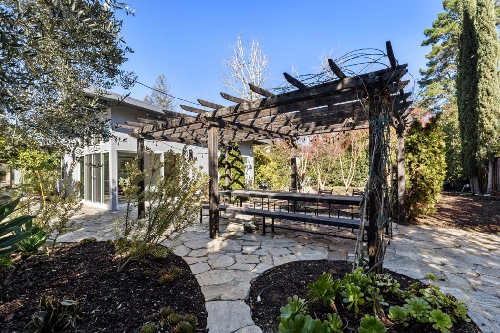 Undisclosed Address Stanford, CA 94305 - Photo 8 of 45 a view of a patio with table and chairs with wooden floor and fence