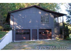 4 Edna Oaks Road Hendersonville, NC 28792 - Photo 2 of 19 a front view of a house with a yard