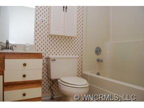 4 Edna Oaks Road Hendersonville, NC 28792 - Photo 11 of 19 a bathroom with a sink a toilet and shower