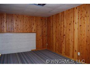4 Edna Oaks Road Hendersonville, NC 28792 - Photo 15 of 19 a view of an empty room with wooden floor