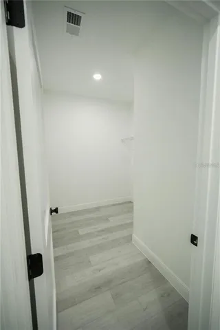 a view of an empty room and window