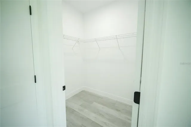 a view of a kitchen with a sink and a window