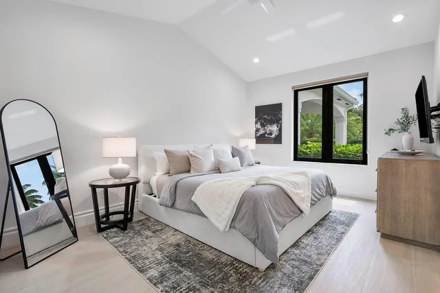 a living room with window and a wooden floor