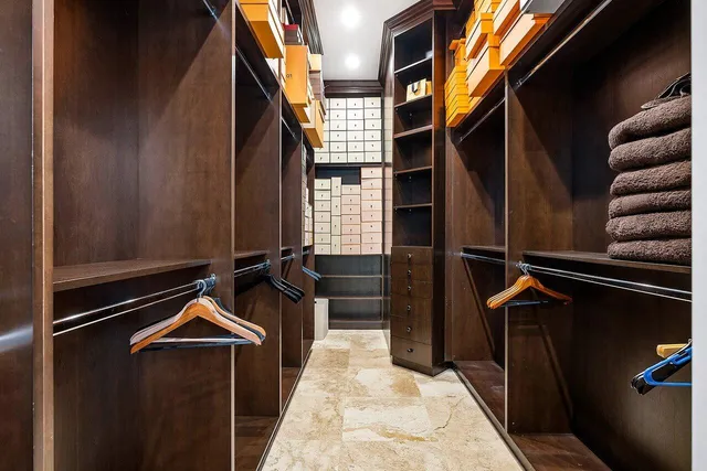 a bedroom with a large bed and a large window