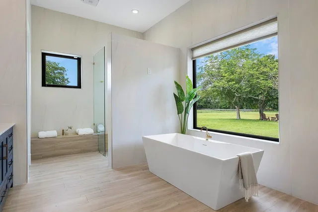 a kitchen with stainless steel appliances kitchen island granite countertop a refrigerator and stove