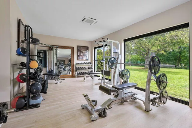 a bathroom with a sink a mirror and bathtub