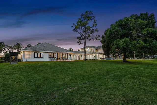 a view of a swimming pool with a table and chairs
