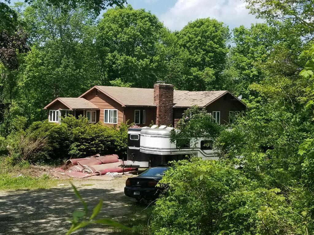 21 Hubbard Hill Road Killingly, CT 06239 - Photo 1 of 1 a front view of a house with yard and green space