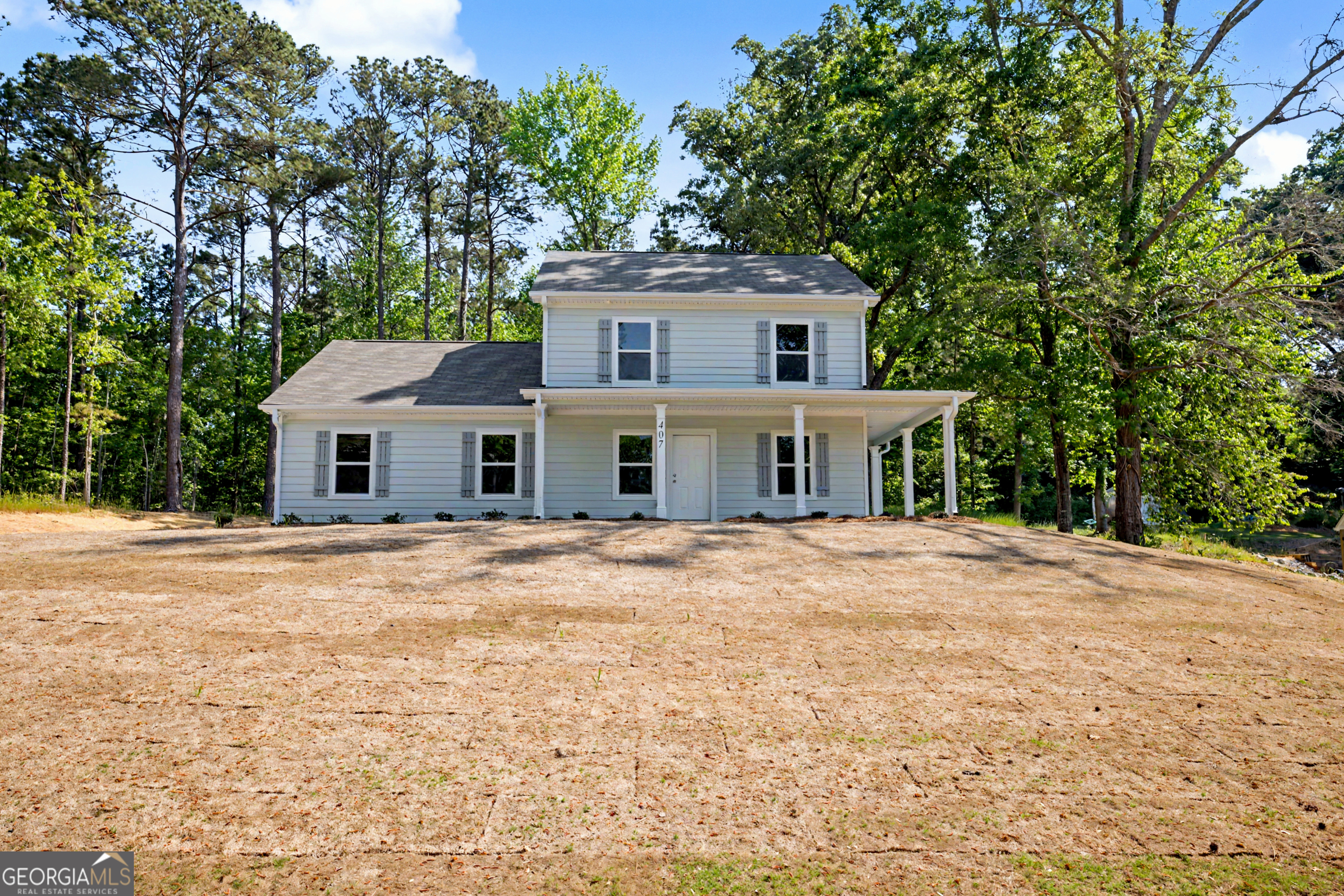 407 Barnetts Bridge Road Jackson, GA 30233 - Photo 1 of 1 a front view of a house with a yard