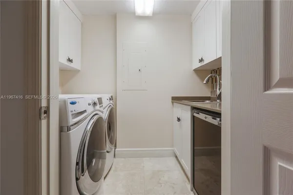 a utility room with dryer and washer