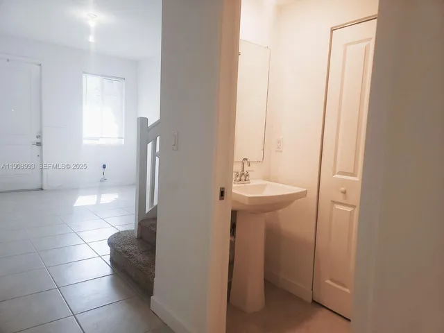 a view of a backyard with swimming pool