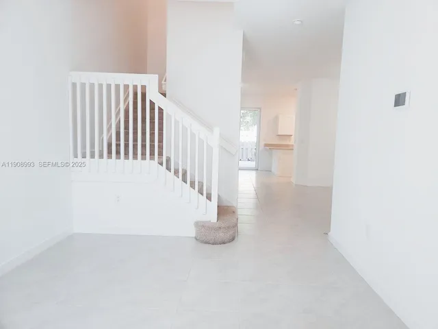 a kitchen with cabinets stainless steel appliances and a sink