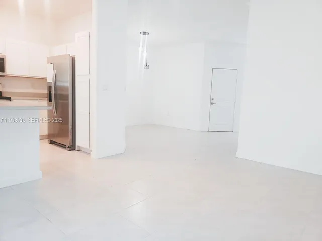 a view of staircase with white walls