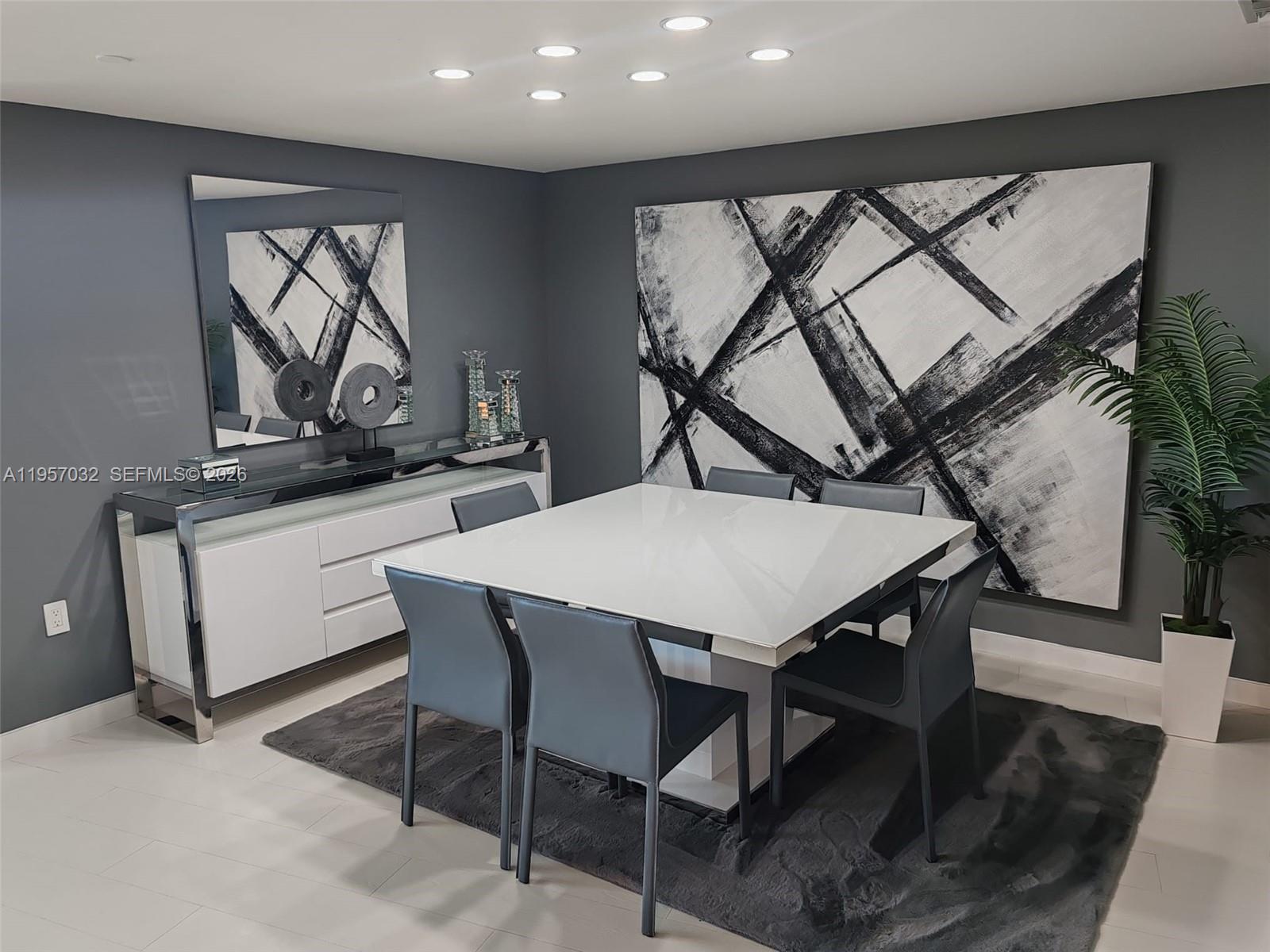 200 Biscayne Blvd Way, Unit 3907 Miami, FL 33131 - Photo 7 of 20 a view of a dining room with furniture and a potted plant