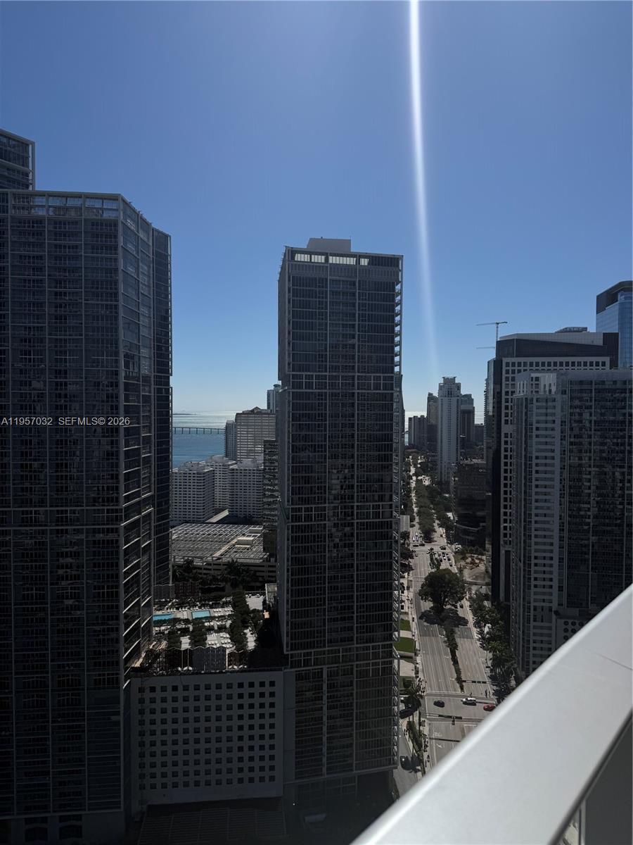 200 Biscayne Blvd Way, Unit 3907 Miami, FL 33131 - Photo 10 of 20 a view of balcony with a couple of cars parked in front of buildings