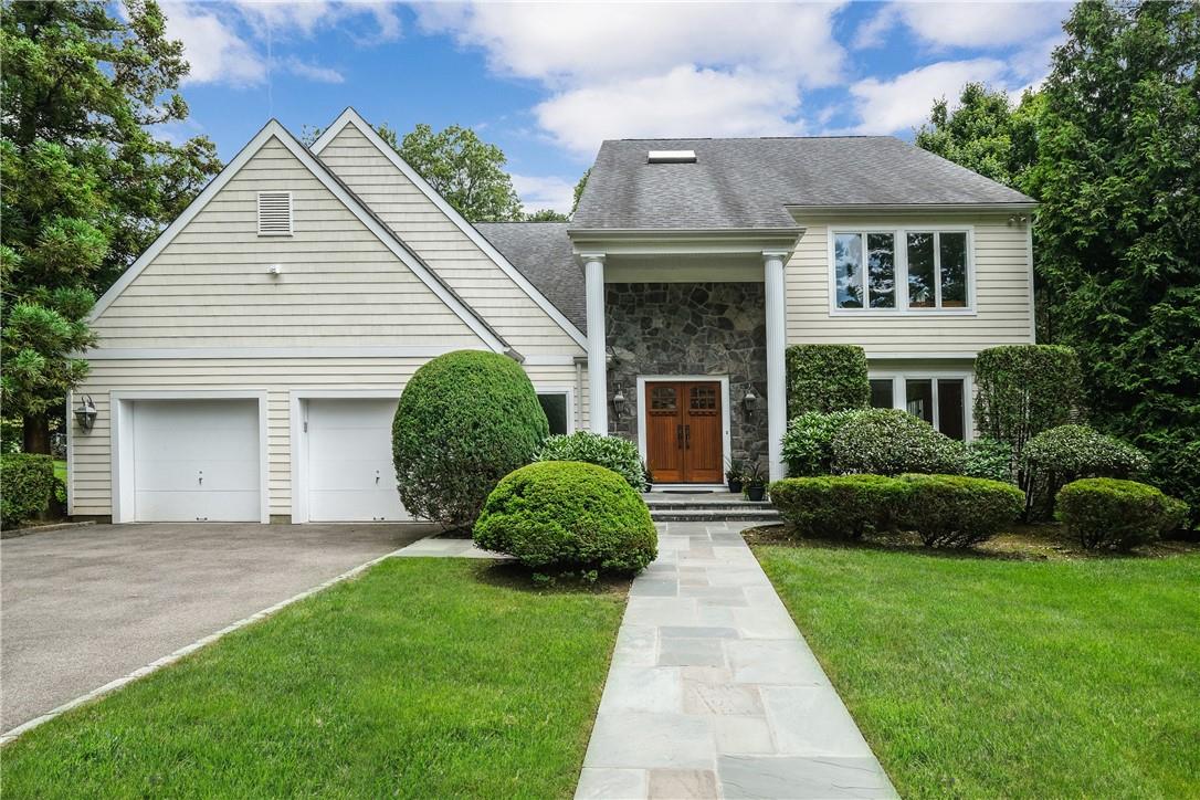 5 Graham Court Rye, NY 10580 - Photo 1 of 1 a front view of a house with a garden