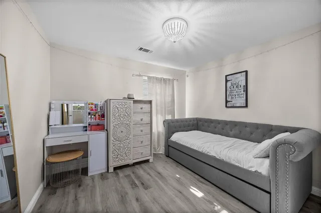 a bathroom with a tub 2 sink and mirror