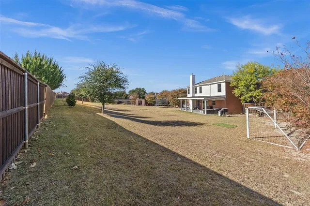 a view of living room and patio filled with furniture