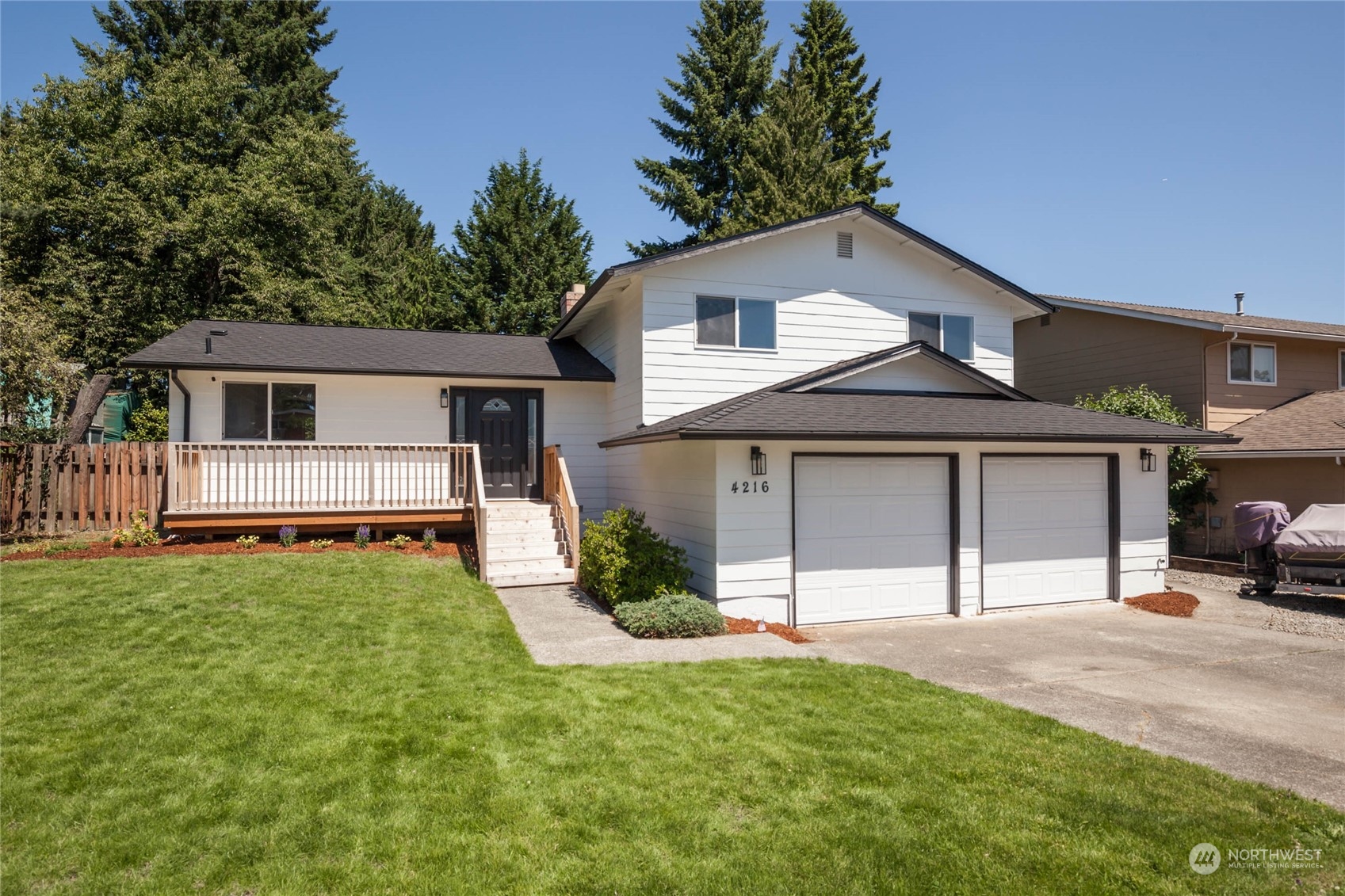 4216 Northeast 20th Street Renton, WA 98059 - Photo 1 of 26 a view of a yard in front view of a house