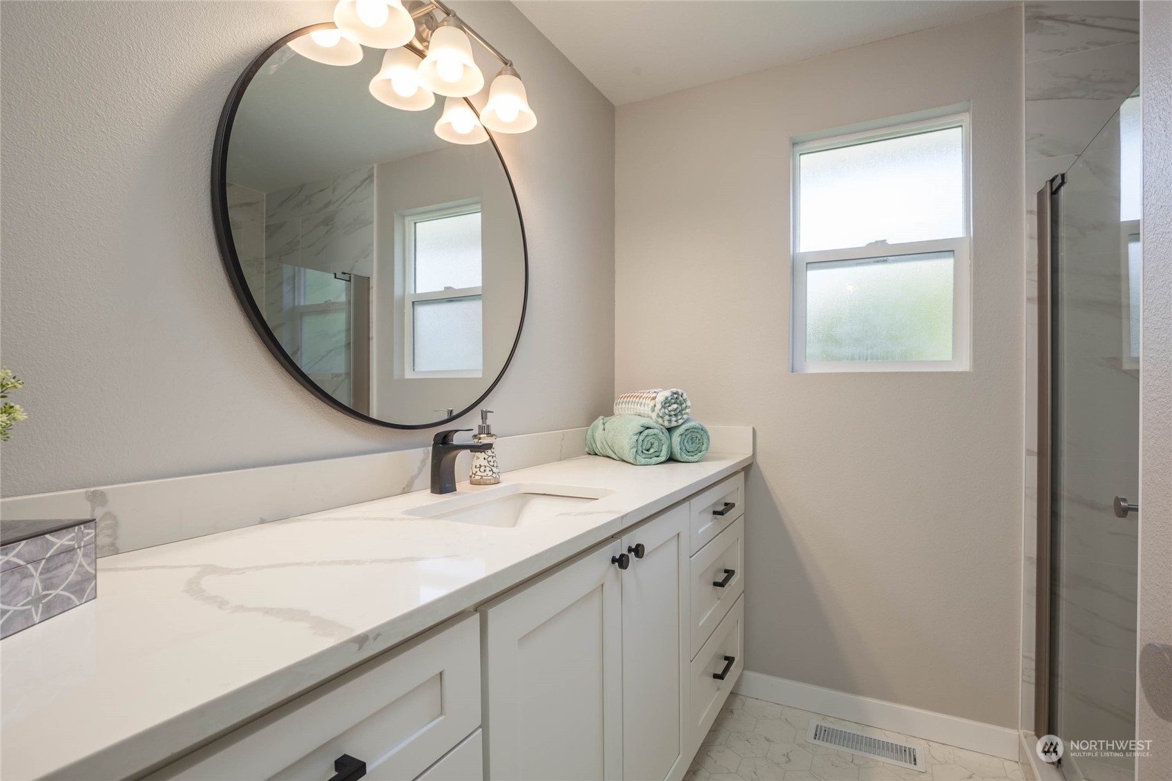 4216 Northeast 20th Street Renton, WA 98059 - Photo 12 of 26 a bathroom with a sink and a mirror