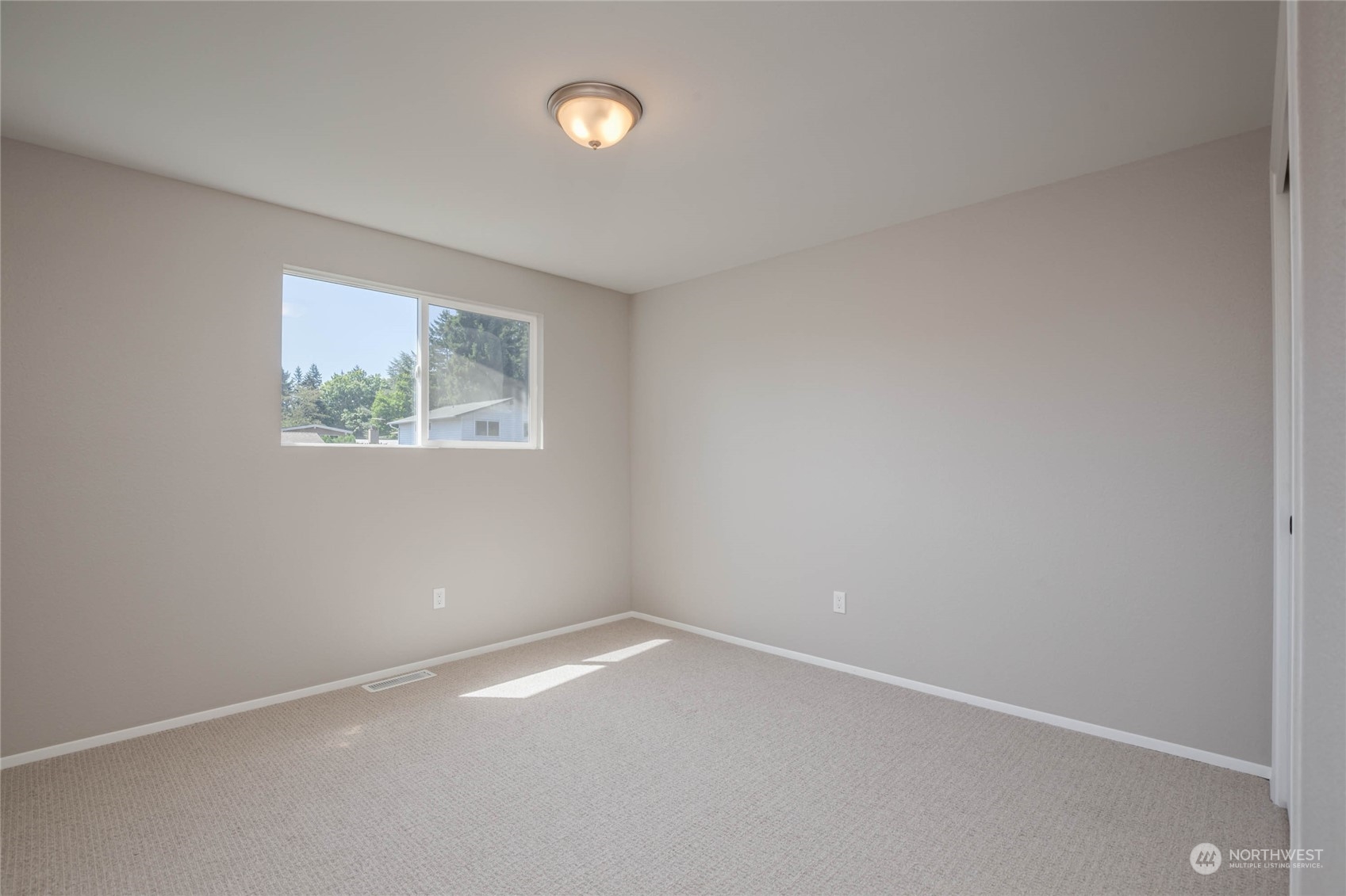 4216 Northeast 20th Street Renton, WA 98059 - Photo 13 of 26 an empty room with windows