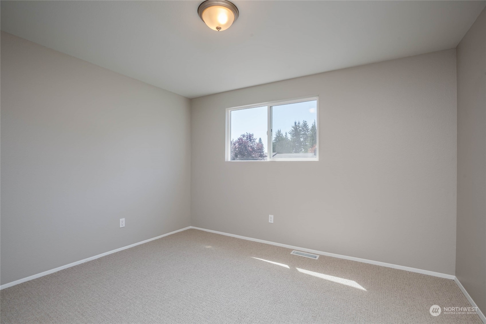 4216 Northeast 20th Street Renton, WA 98059 - Photo 14 of 26 an empty room with windows