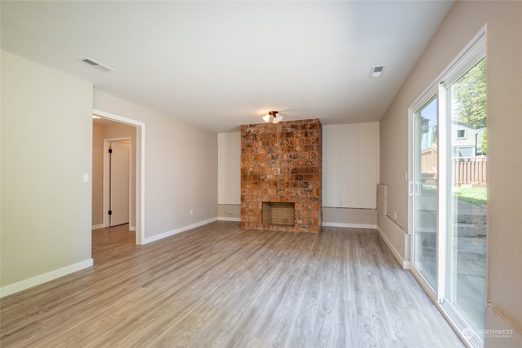 4216 Northeast 20th Street Renton, WA 98059 - Photo 16 of 26 wooden floor in an empty room with a window