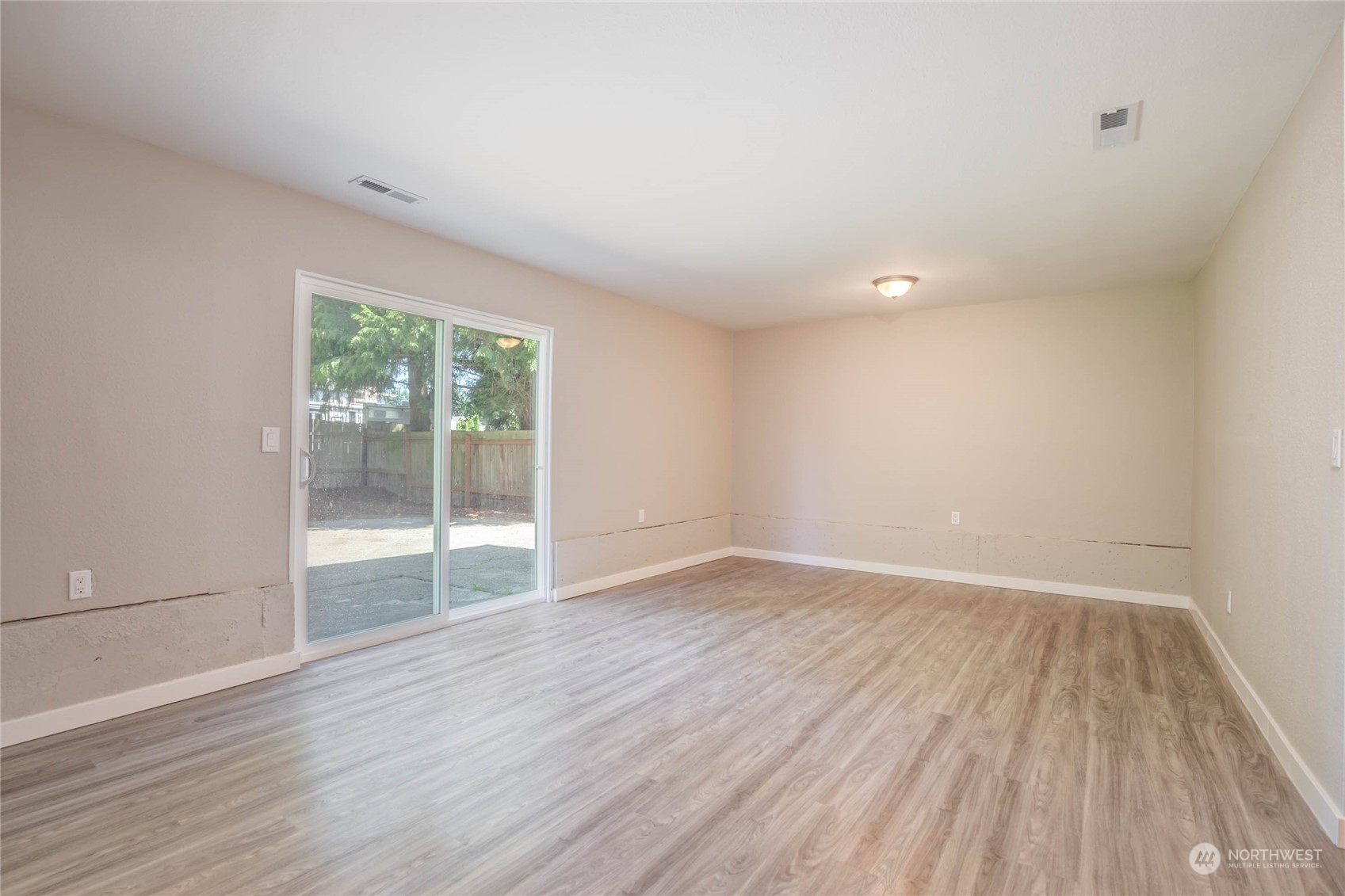 4216 Northeast 20th Street Renton, WA 98059 - Photo 17 of 26 wooden floor in an empty room with a window