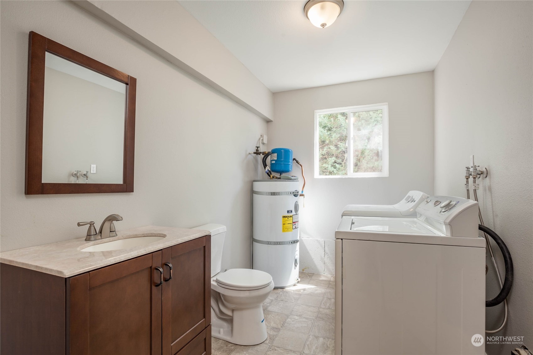 4216 Northeast 20th Street Renton, WA 98059 - Photo 18 of 26 a bathroom with a sink toilet and a window