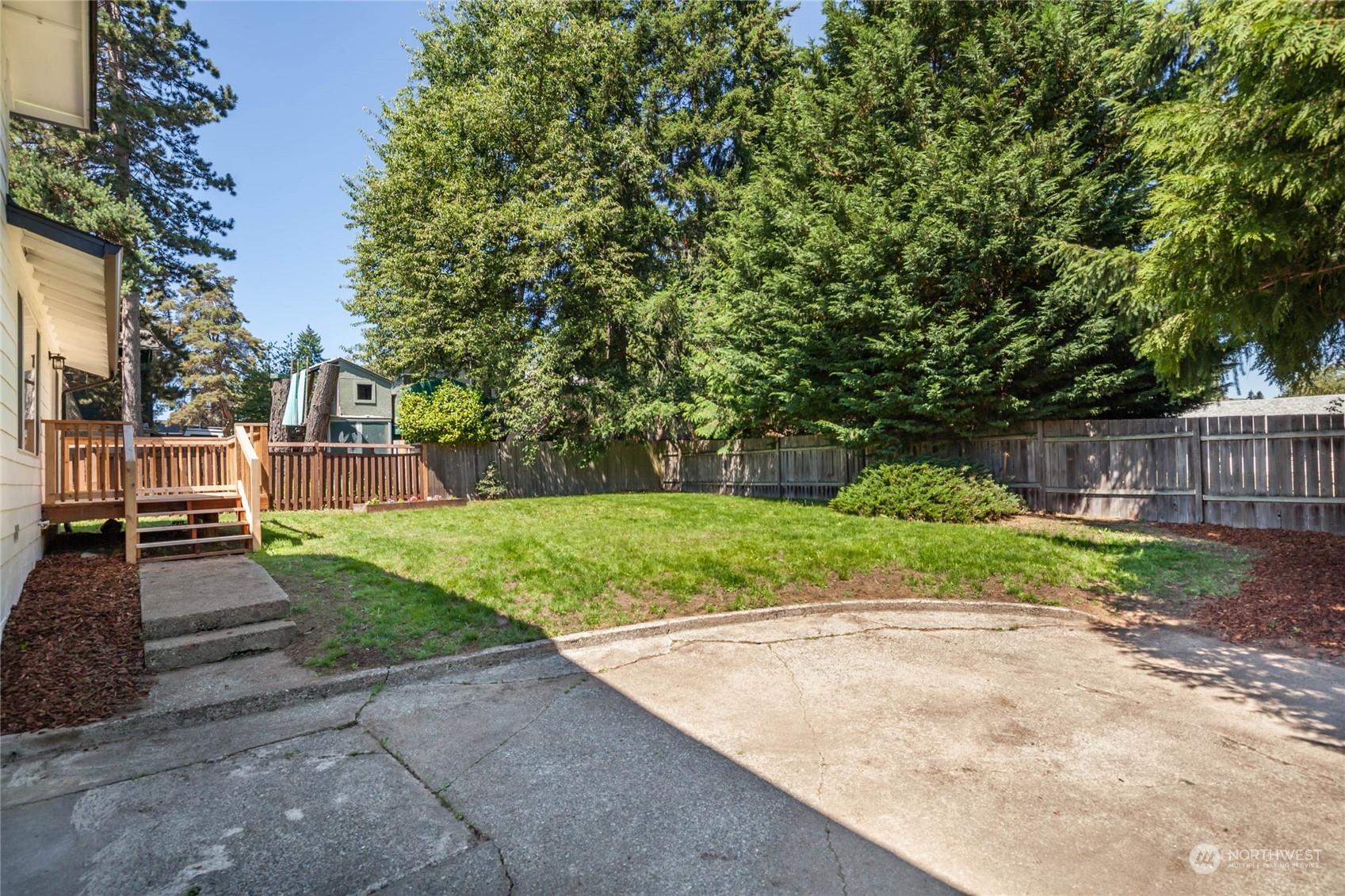 4216 Northeast 20th Street Renton, WA 98059 - Photo 19 of 26 a view of a yard with plants and a trees