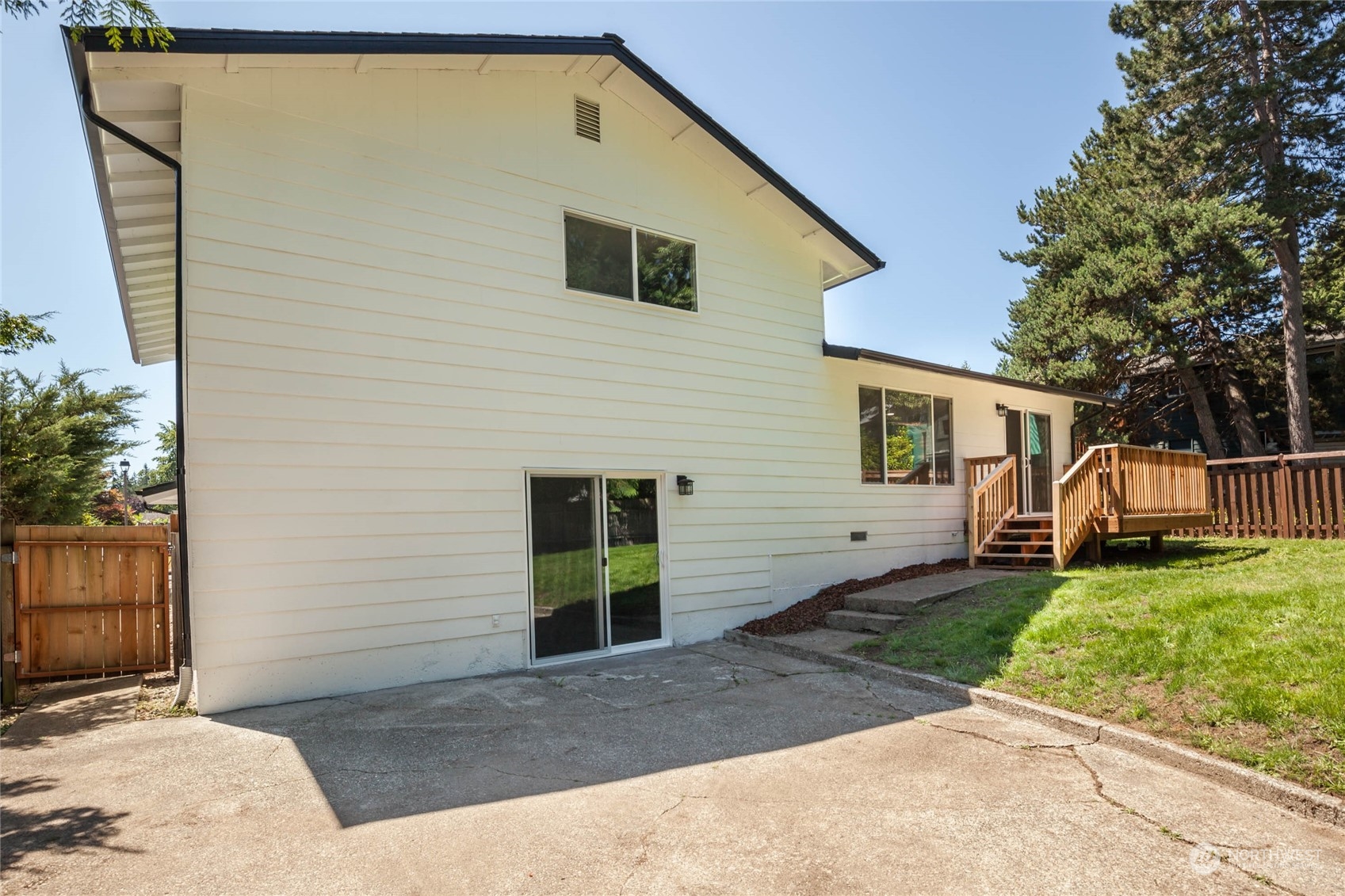 4216 Northeast 20th Street Renton, WA 98059 - Photo 20 of 26 a view of a house with a yard