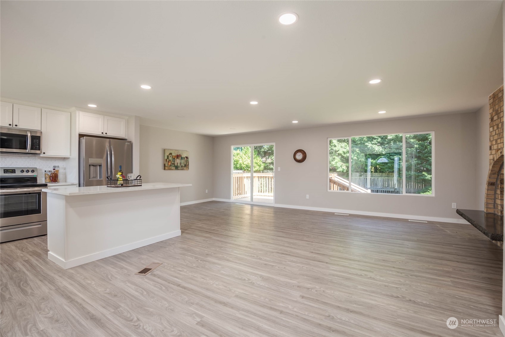 4216 Northeast 20th Street Renton, WA 98059 - Photo 2 of 26 a view of a kitchen with wooden floor and a window
