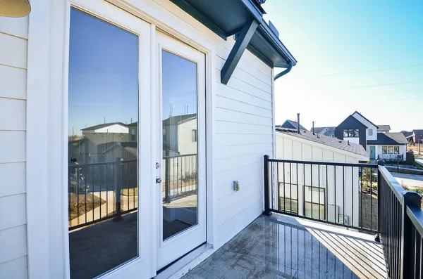 a view of a balcony with cars