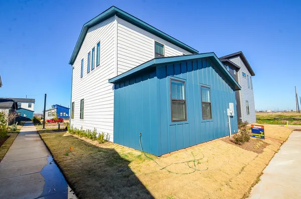 a view of a cars park on the side of a street