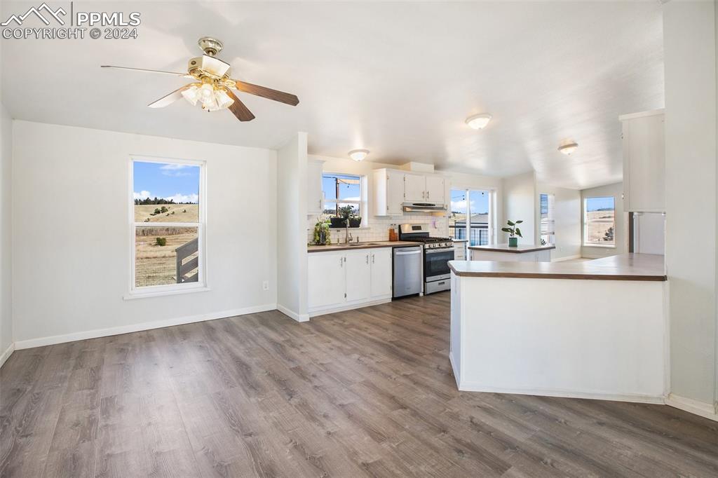 69 Aspen Drive Divide, CO 80814 - Photo 11 of 50 a kitchen with stainless steel appliances granite countertop a stove top oven a sink dishwasher and a refrigerator