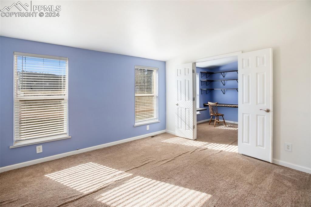 69 Aspen Drive Divide, CO 80814 - Photo 26 of 50 a view of a bedroom with a window and a kitchen