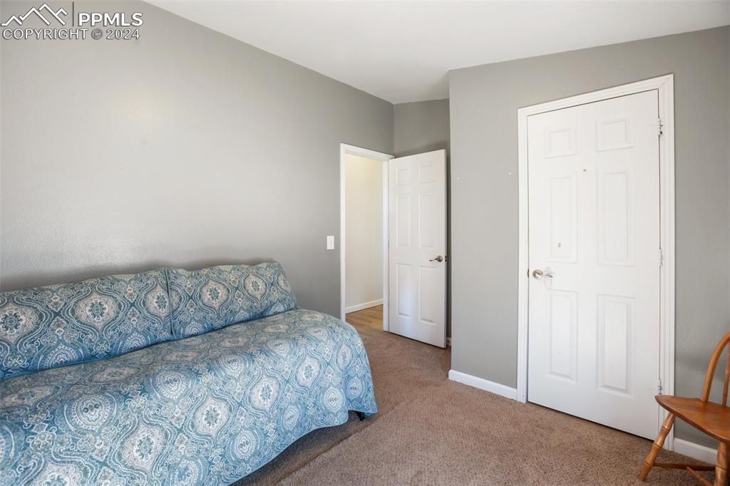 69 Aspen Drive Divide, CO 80814 - Photo 32 of 50 a bedroom with a bed and a chair