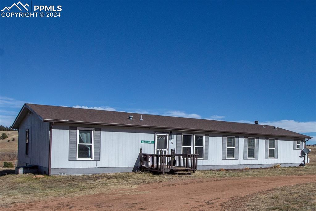 69 Aspen Drive Divide, CO 80814 - Photo 46 of 50 a front view of a house with a yard