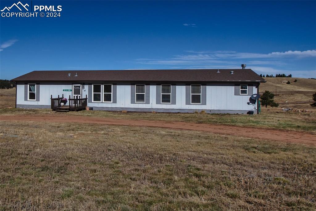 69 Aspen Drive Divide, CO 80814 - Photo 48 of 50 a front view of a house with a yard