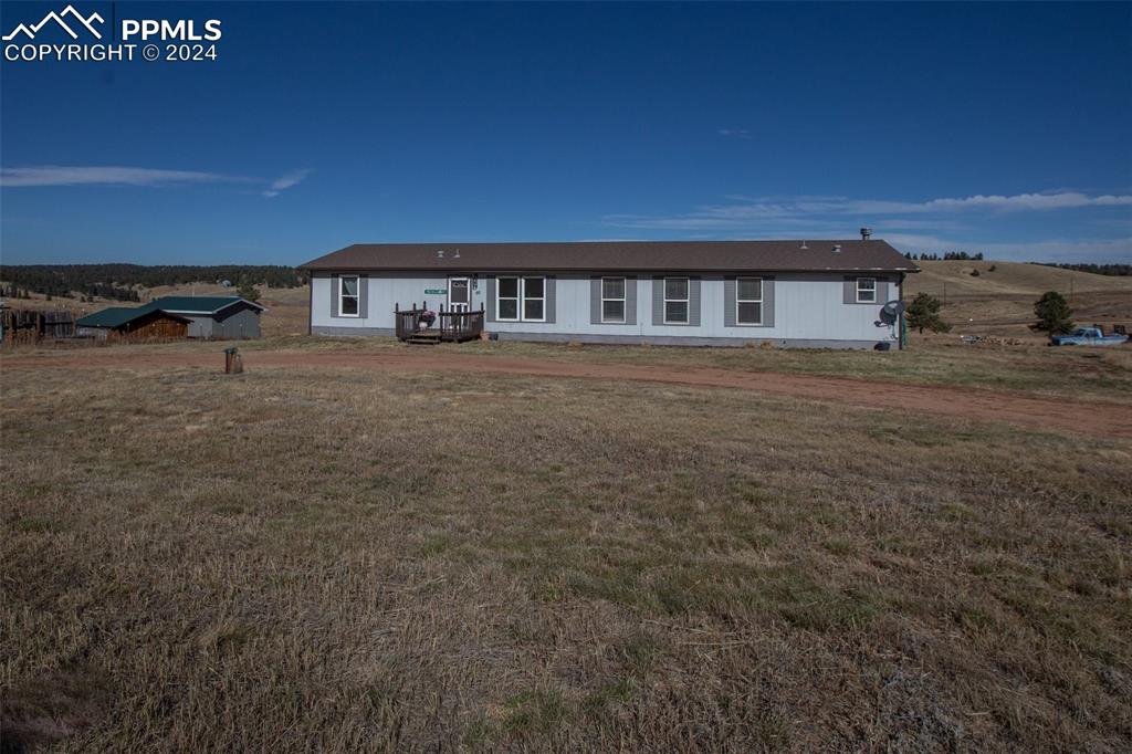69 Aspen Drive Divide, CO 80814 - Photo 49 of 50 a front view of a house with a yard