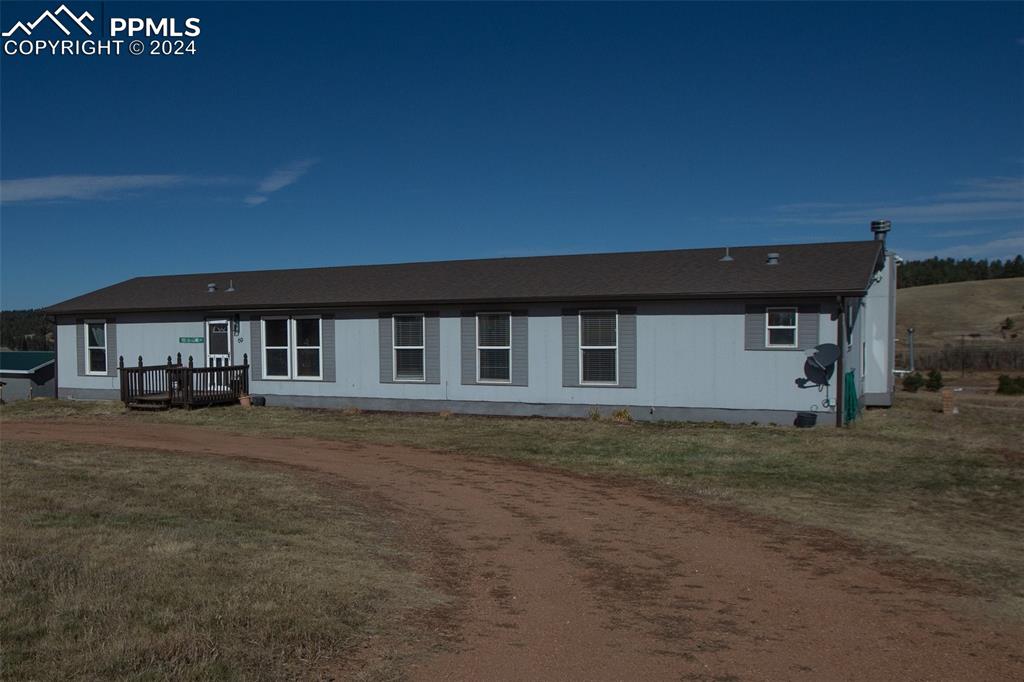 69 Aspen Drive Divide, CO 80814 - Photo 50 of 50 a front view of a house with a garden