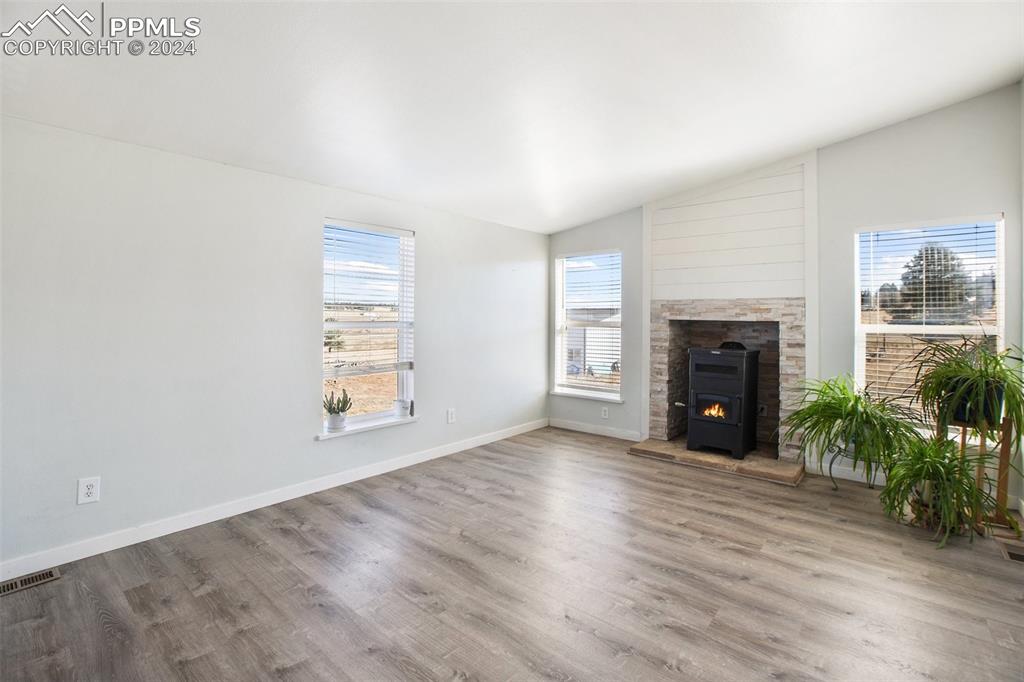 69 Aspen Drive Divide, CO 80814 - Photo 7 of 50 an empty room with windows and fireplace