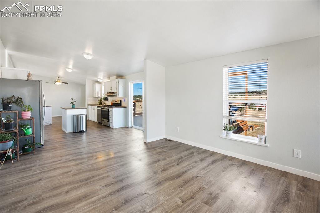 69 Aspen Drive Divide, CO 80814 - Photo 9 of 50 a view of a kitchen with furniture and wooden floor