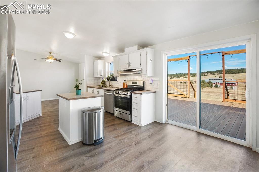 69 Aspen Drive Divide, CO 80814 - Photo 10 of 50 a kitchen with cabinets and wooden floor