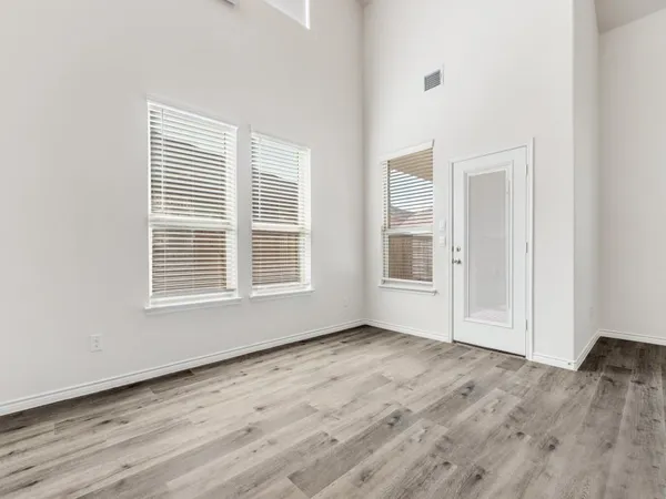 a view of kitchen with cabinets and wooden floor