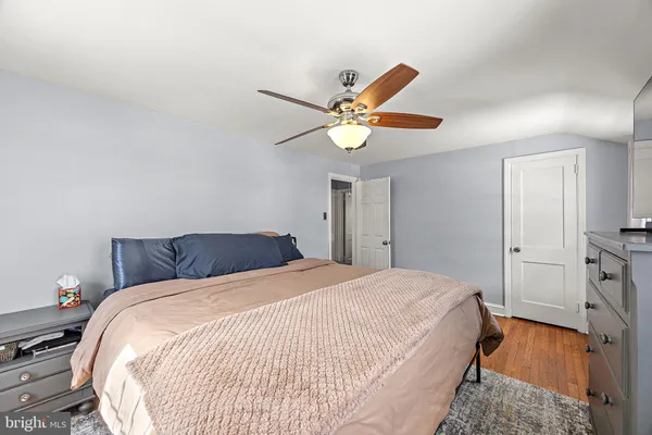 a bed room with a bed and a chandelier